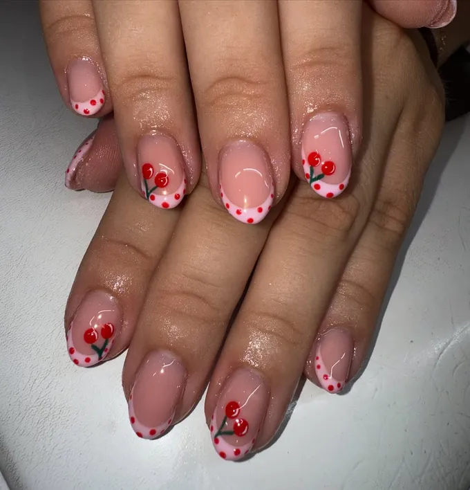 Cherry-red French nail tips by Autumn Rose Hair & Beauty